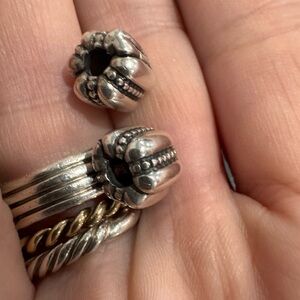 two silver Pandora clip-on charms